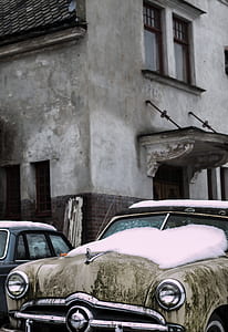 classic vehicle parked in front of building at daytime thumbnail