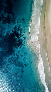 body of water at calm wave thumbnail
