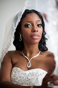 woman wearing white lace wedding dress and veil thumbnail