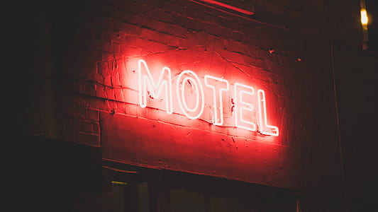 lighted MOTEL signage at night time thumbnail