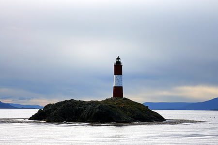 photography of lighthouse center of body of water thumbnail