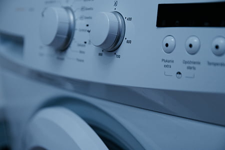 selective focus photography of white front-load clothes washer knob thumbnail