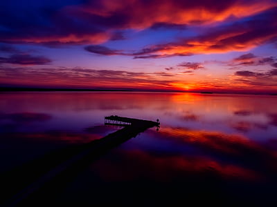 silhouette of dock during golden hour thumbnail