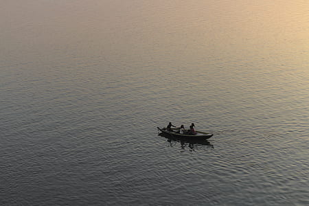 three people sailing on boat thumbnail