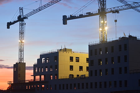 two cranes on top of building thumbnail
