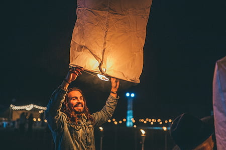 person holding on paper balloon thumbnail