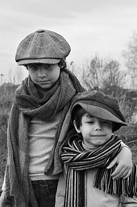 grayscale photo of two boys thumbnail