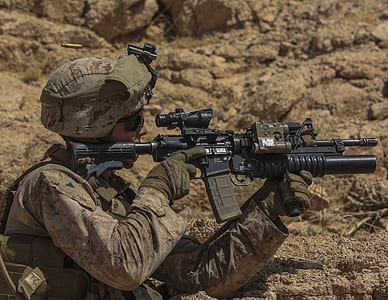 man holding rifle thumbnail