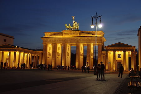 people standing near concrete arch thumbnail