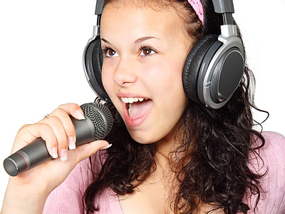 woman wearing gray headphones holding microphone thumbnail