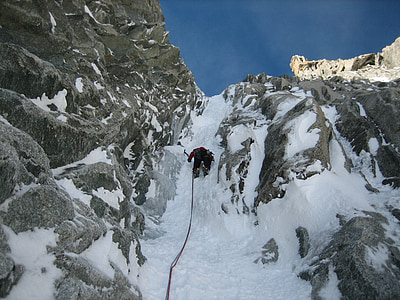 person climbing mountain with snow thumbnail