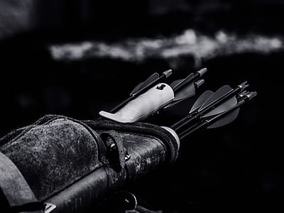 Grayscale Photo of Arrow Inside Black Case thumbnail