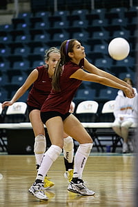 two women playing volleyball thumbnail