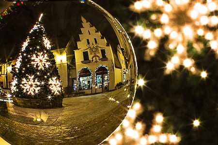 reflection of Christmas tree with string lights and baubles in brown baubles thumbnail