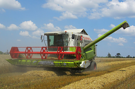 green and white combine harvester thumbnail