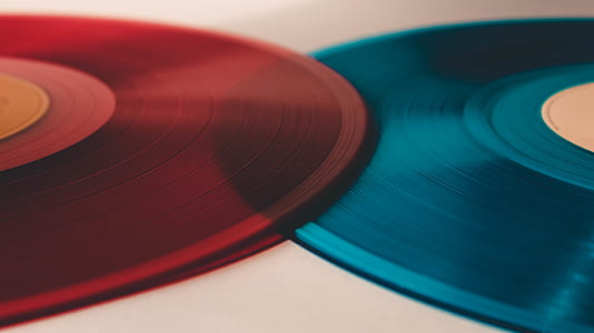 closeup photo of two red and blue vinyl records thumbnail