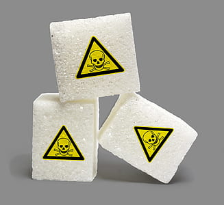 three white boxes with yellow poisonous stickers closeup photography thumbnail