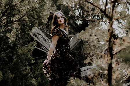 woman wearing floral dress at woods thumbnail