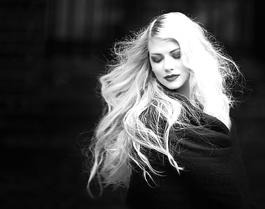 gray scale photo of woman wearing black top thumbnail