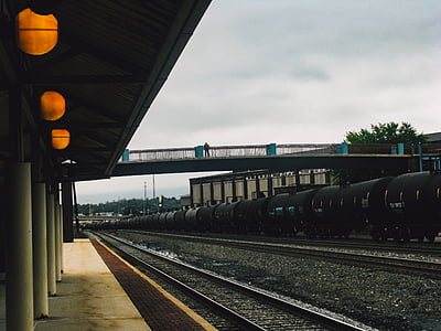 black train beside station thumbnail