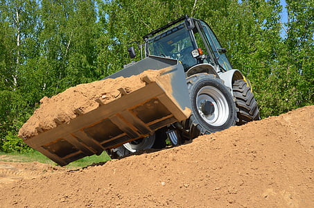 grey front loader carrying soil thumbnail