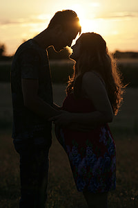 silhouette of couple standing during sunset thumbnail
