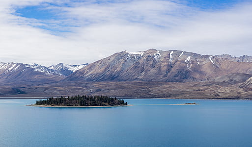 aerial photo of island beside mountain thumbnail