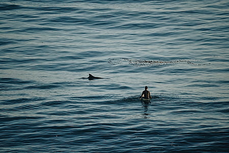 man surfing on body of water thumbnail