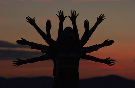 silhouette of people raising hands thumbnail