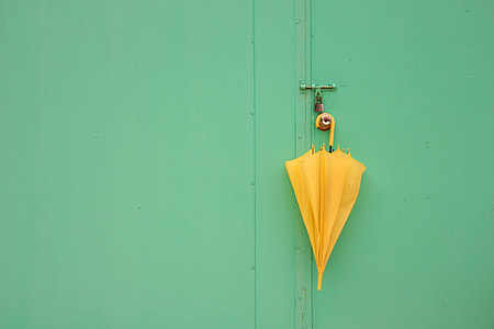 yellow umbrella on gate lever thumbnail