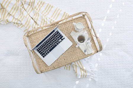 silver MacBook on top of wooden tray thumbnail