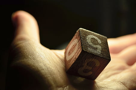 person holding black cube thumbnail