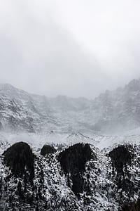 snowcap mountain under gray sky thumbnail
