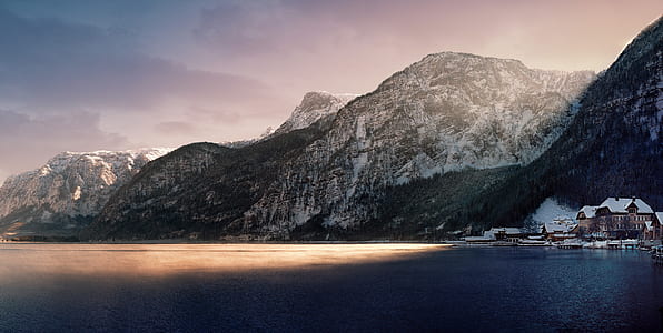 photography of brown house beside mountain thumbnail