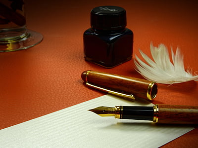 brown fountain pen on white ruled paper thumbnail
