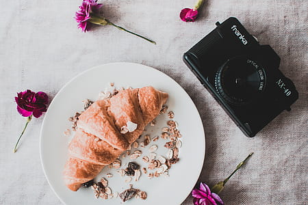 Black Franka Dslr Camera Beside Croissant thumbnail