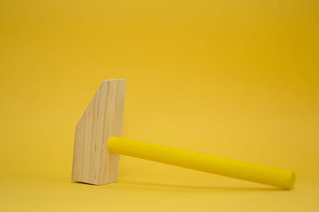 photo of brown and yellow hammer toy thumbnail
