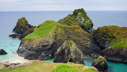rock formation on body of water thumbnail