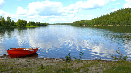 red boat near lake thumbnail