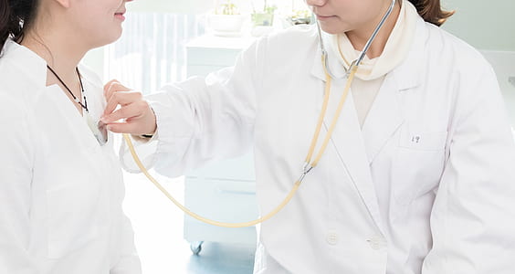 doctor listening to patient's heartbeat using stethoscope thumbnail