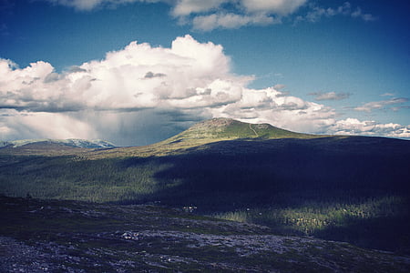 cloudy sky over mountain thumbnail