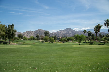 long-angle photography of golf course under cirrus clouds thumbnail