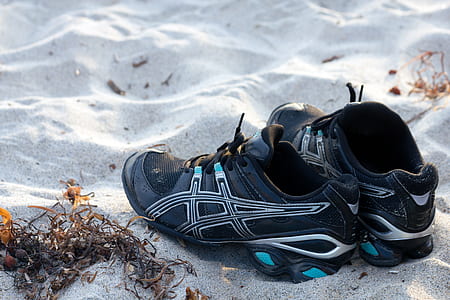 pair of black Asics shoes thumbnail