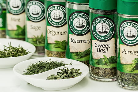 assorted spice bottles on white surface thumbnail