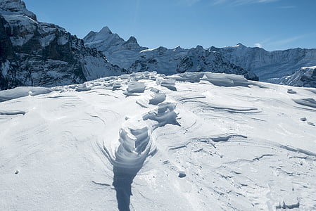 snow covered mountain taken during daytime thumbnail