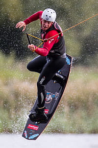 man wakeboarding in selective focus photography thumbnail