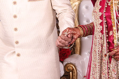 man and woman holding hands together thumbnail