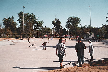 people skating on skate rink during daytime thumbnail