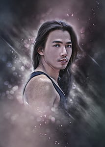 tilt shift lens photography of man in black tank top thumbnail