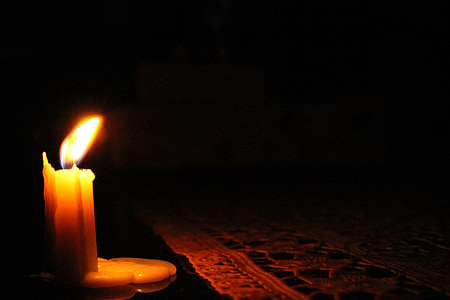 lighted candle near tablecloth thumbnail